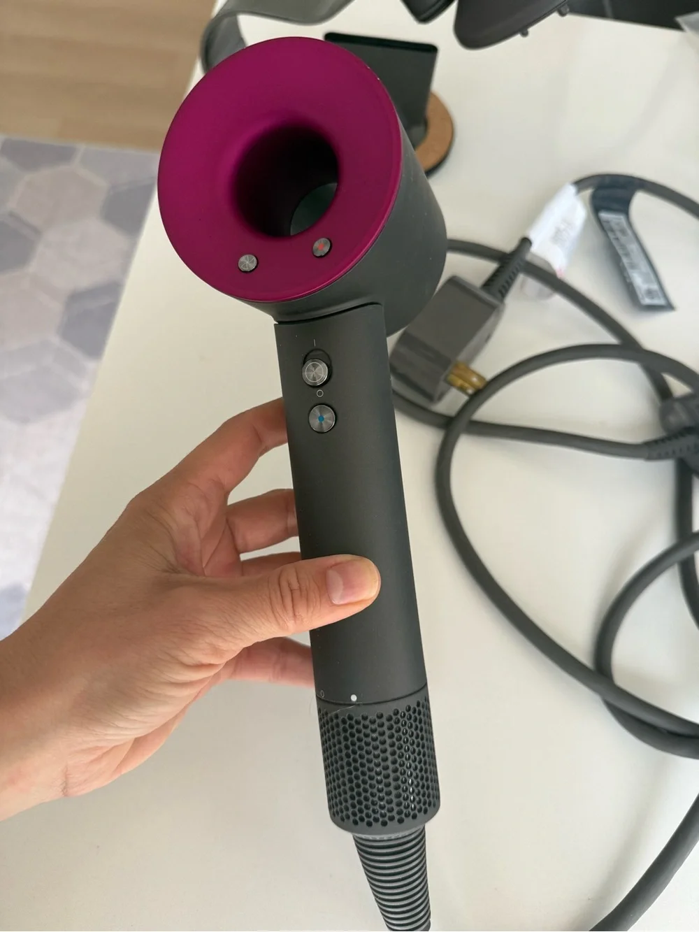 Dyson hair dryer with diffuser and cord in charcoal and magenta accents